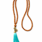 Mala de Rudraksha con Borla Turquesa – Calma y Protección